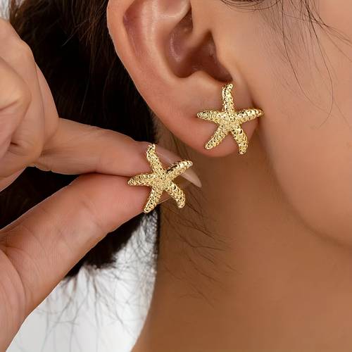 a pair of cool and trendy earrings for women simple and unique stud earrings versatile and high end commuter ear accessories