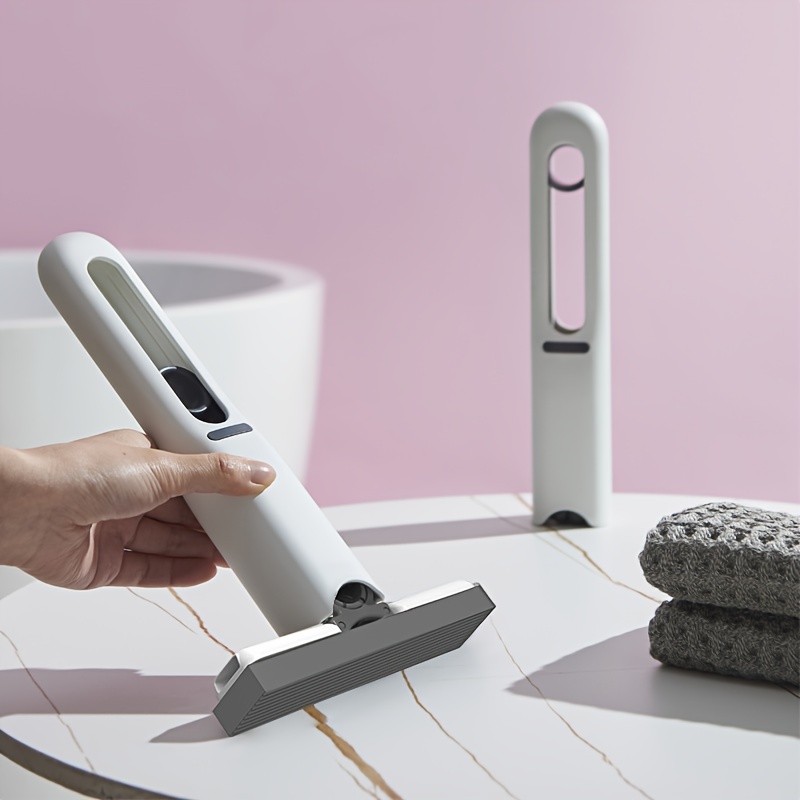 Handheld Multifunctional Cleaner, Equipped with Replaceable Mop Heads And a Hook. The Rotating Mop Head Allows for Easy And Forceful Cleaning of Gaps And Corners in Sinks, Pet Urine, And Desktop Debris. A Portable Marine Cleaning Mop/Tool.