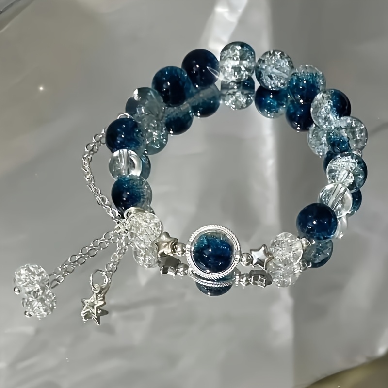 

Bracelet de Perles Bleues avec Pendentif Étoile pour Galaxie - Design Ajustable - Cadeau Mignon - Accessoire Tendance pour Tous