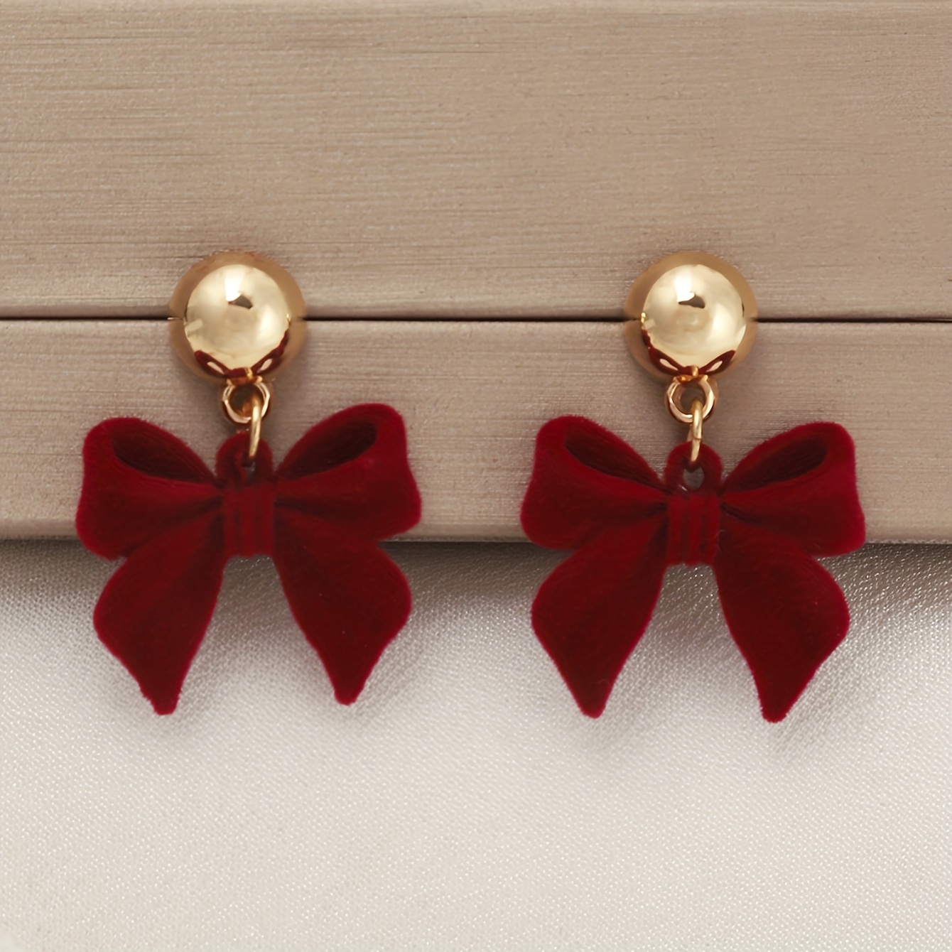 Image of A Pair Of Festive Red And Black Velvet Bows, As Well As Earrings And Earrings, Perfect For Daily Wear And New Year's Wear To Enhance