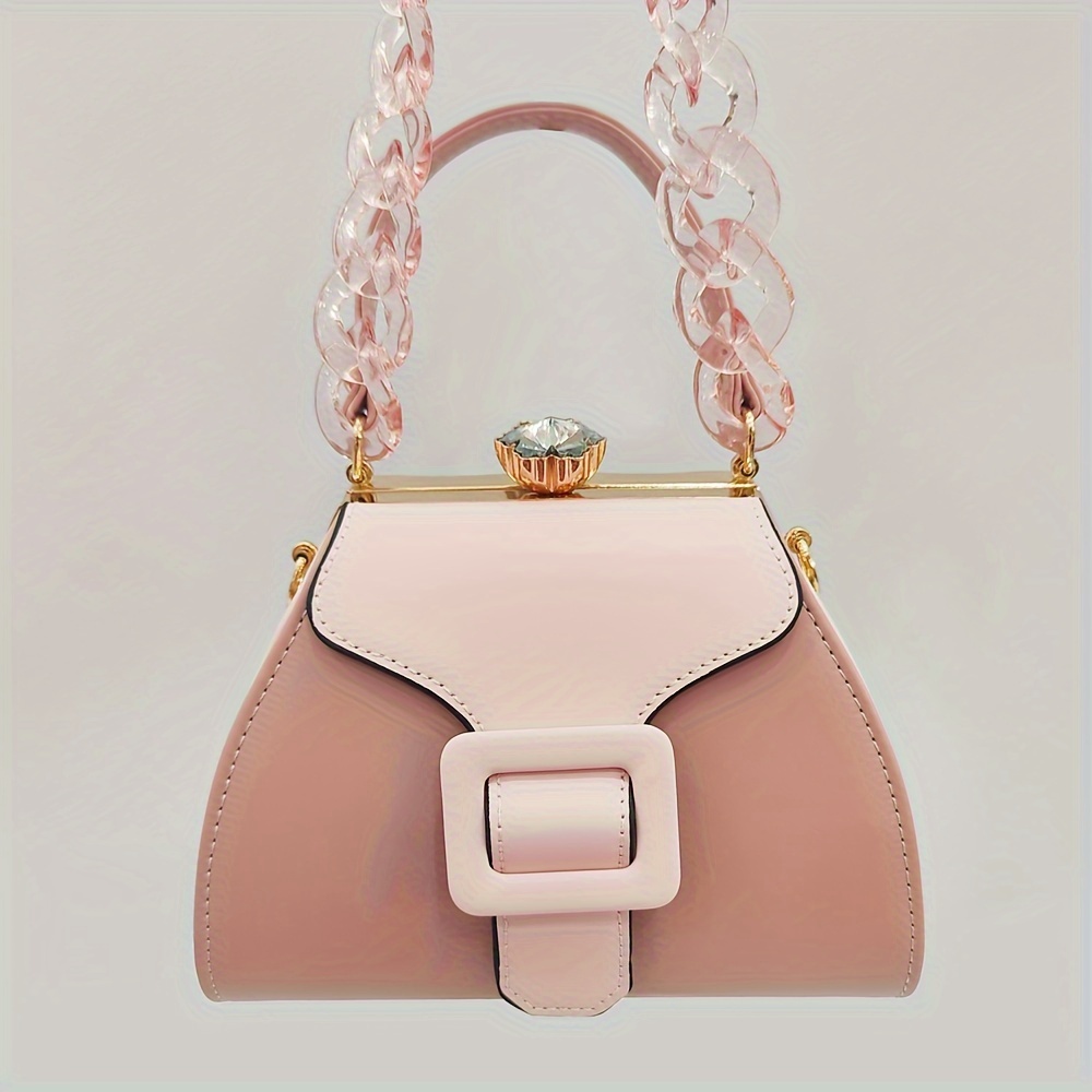 Stylish Two-Tone Round Handbag Made of Durable, Featuring a Detachable Acrylic Chain And Snap Closure. This Versatile Handbag Is Perfect for Both Parties And Everyday Use.