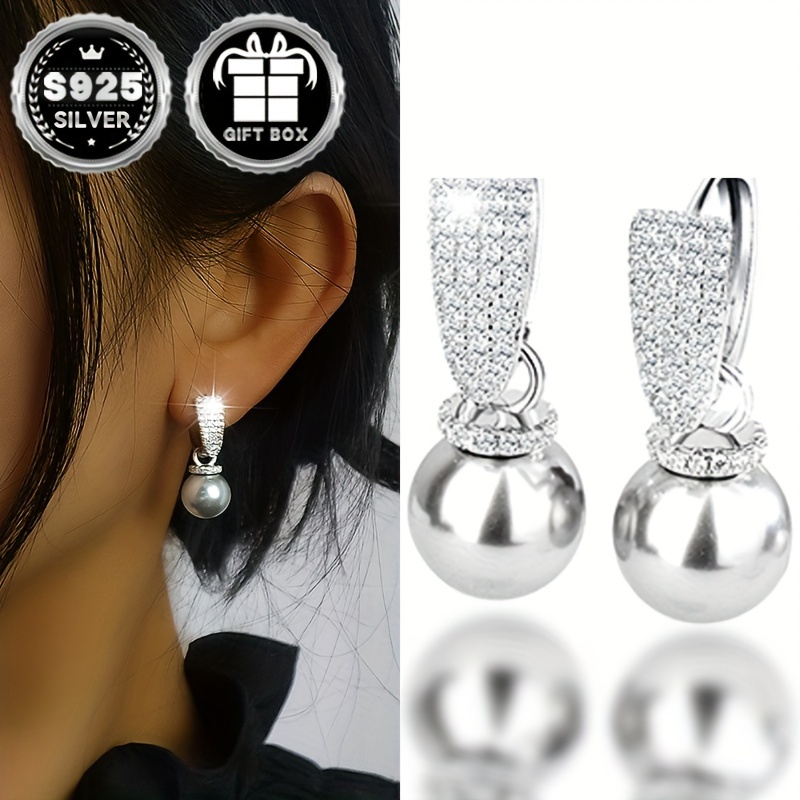 

Boucles d'oreilles élégantes en argent sterling 925 Vana avec de perle et accents de strass, hypoallergéniques, motif de perle grise pour un - Ensemble de 2 pièces