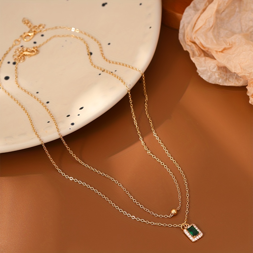 A Set of Two Stylish Classic Thanksgiving Necklaces Featuring Rectangular Pendants Inlaid with Zirconia Stones, Perfect for Layering, Along with Copper Bead Pendants, Making It an Ideal Gift for Women