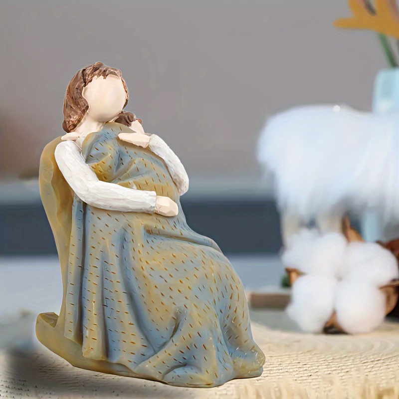 

A Sculpture Ornament Of Maternal Love, Where A Mother Sits In A Rocking Chair Holding Her Child. Slowly, Maternal Love Can Be Used To Decorate The Living Room And Bedroom.