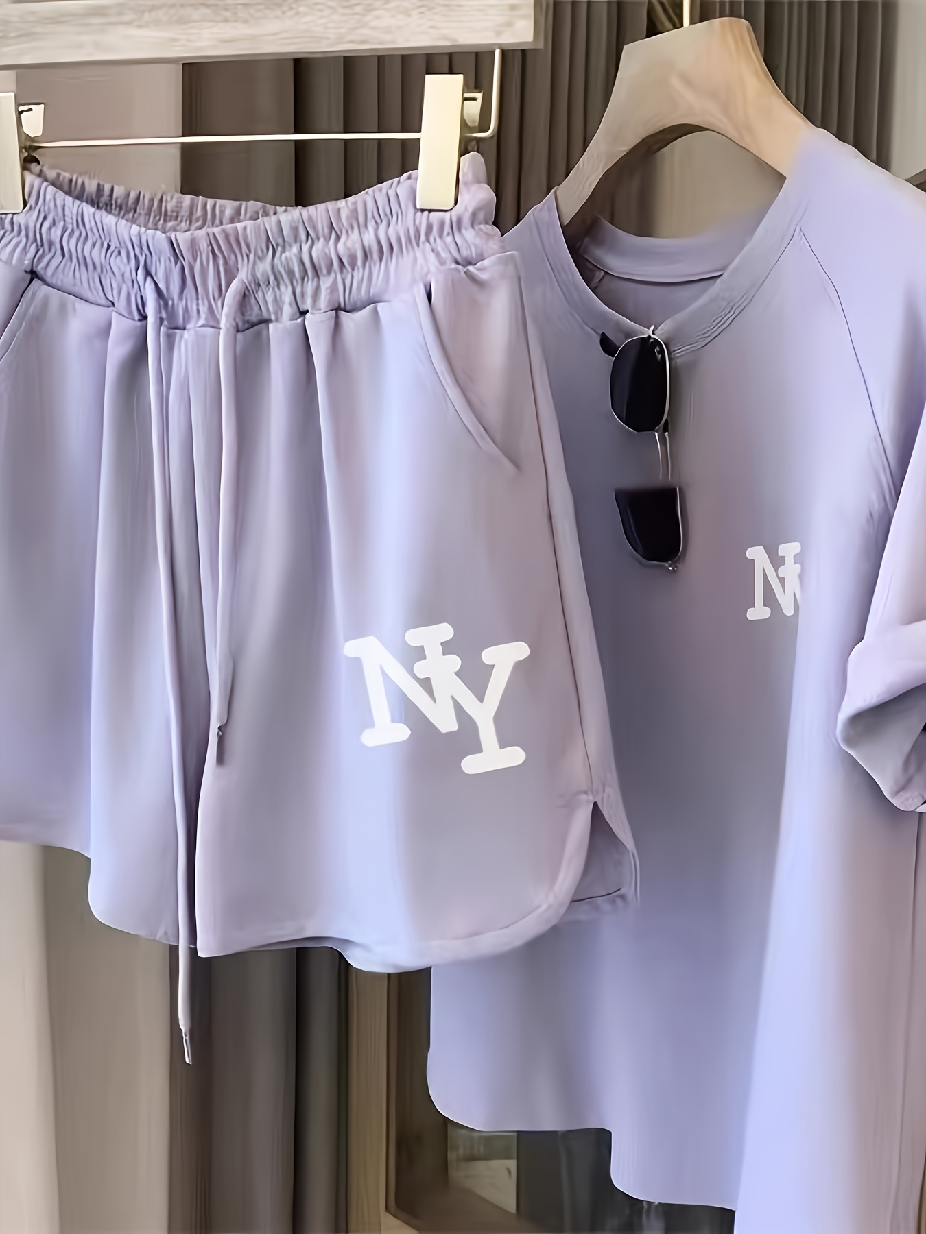 a lightweight womens sporty casual suit featuring a simple letter print round neck top and shorts set suitable for daily wear in the summer for women