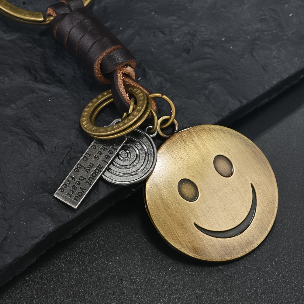 TEMU 【新商品】メンズ＆レディース向け トレンドのティブキーホルダー。合金製の小さなギフト。ヴィンテージのエンド、笑顔の顔と織りレザーペンダントが特徴。