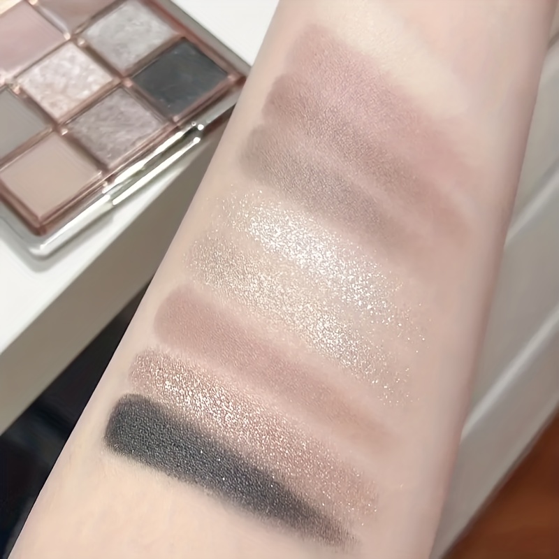 9-color eyeshadow palette - smoky grey, brown and pink tones, mousse eyeshadow, matte and shimmery finishes, fine Shimmery glitter, low saturation all-in-one palette with matte earthy tones, fine powder texture that doesn't fly off