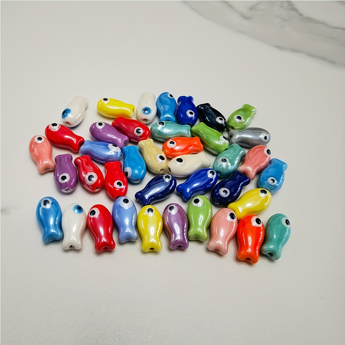 

10 Random Multicolored Ceramic Fish Beads For Accessories Like Bracelets And Earrings.