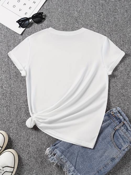 a floral themed womens t shirt featuring a colorful of small daisies in colors such as orange and white designed with a soft short sleeved round neck for casual spring and summer wear