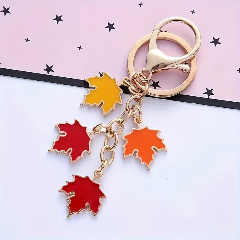 

1pc Maple Leaf Alloy Keychain - Creative Car Accessories & Earphone Case Decor, Men' Key Ring, Zinc Alloy, Elegant Style, Non-woven