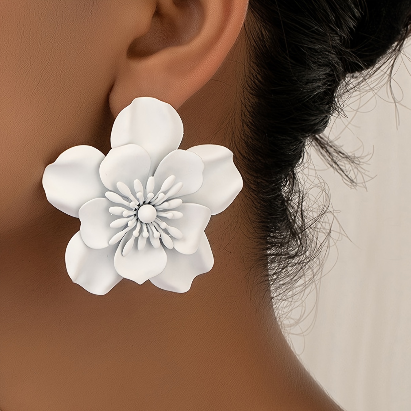white flower earrings sold on Temu United States