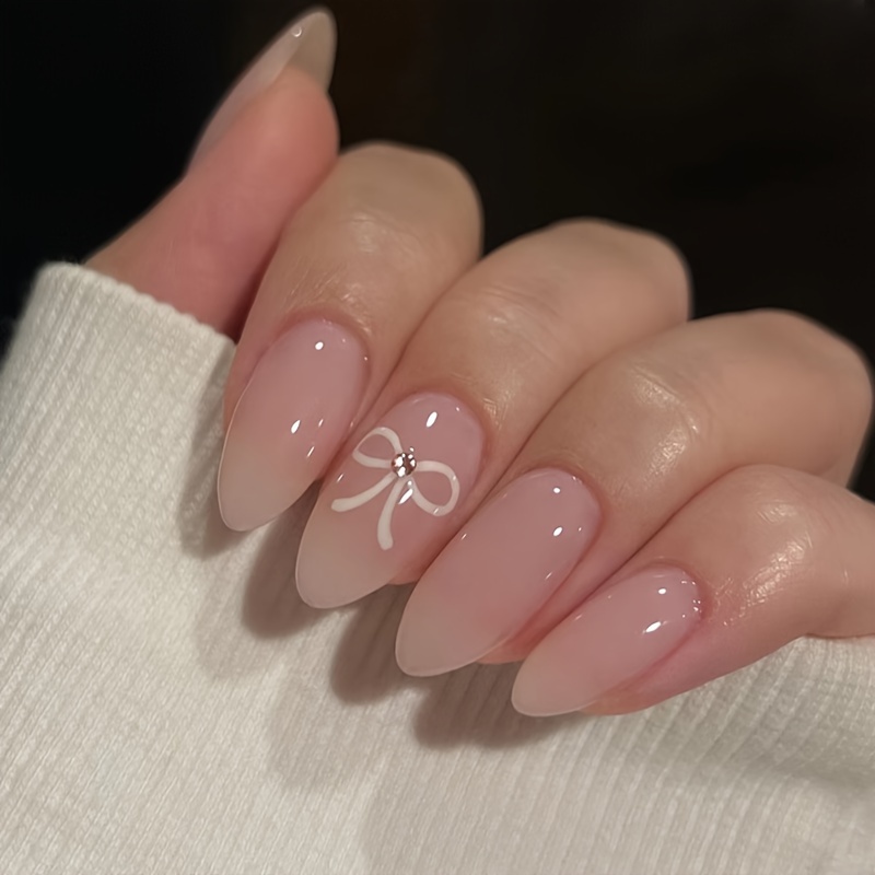 

Adorable Bow Wearing Nails - Removable Acrylic Nail Tips - Almond Shape - Medium Length - Glossy Finish - Nude And Pink Hues