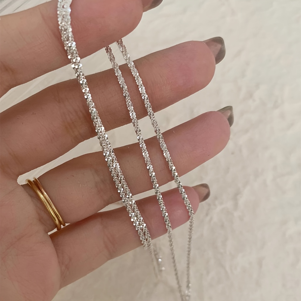 A Sleek And Sexy Shimmering Waist Chain, Perfect For Women To Wear At Vacation Parties: retailer-supplied image