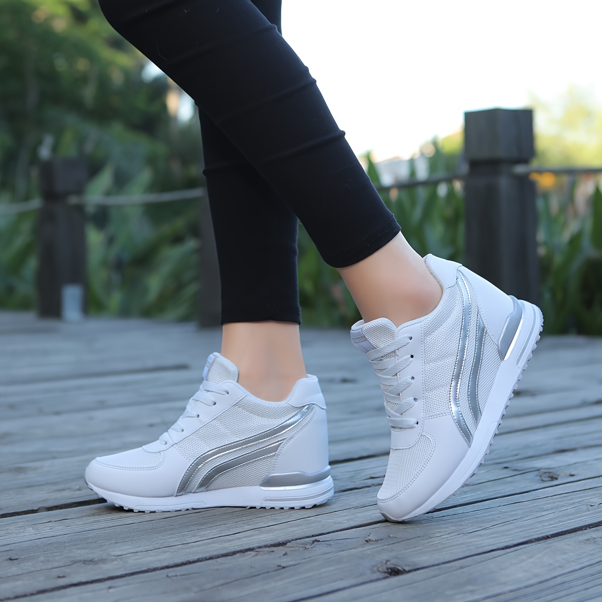 White ladies wedge sneakers sold by 100 Spartans