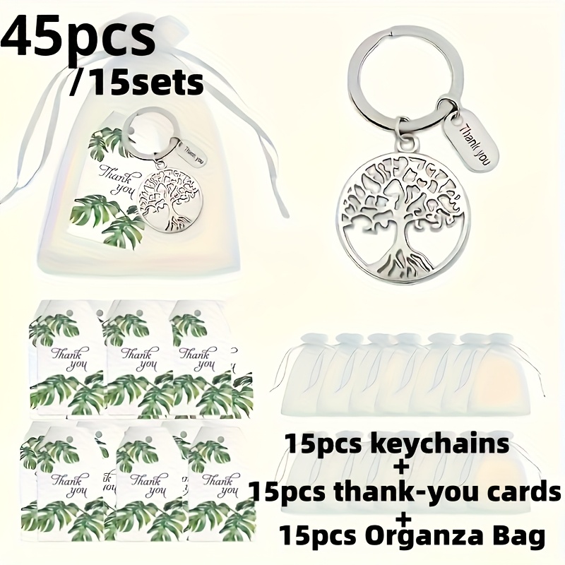 E-shop Geschenk für Sie/Ihn 45-teiliges 15er Set Schlüsselanhänger Geschenkset. Enthält 15 grüne Blatt Dankeskarten, 15 weiße Organzabeutel, 15 Metall