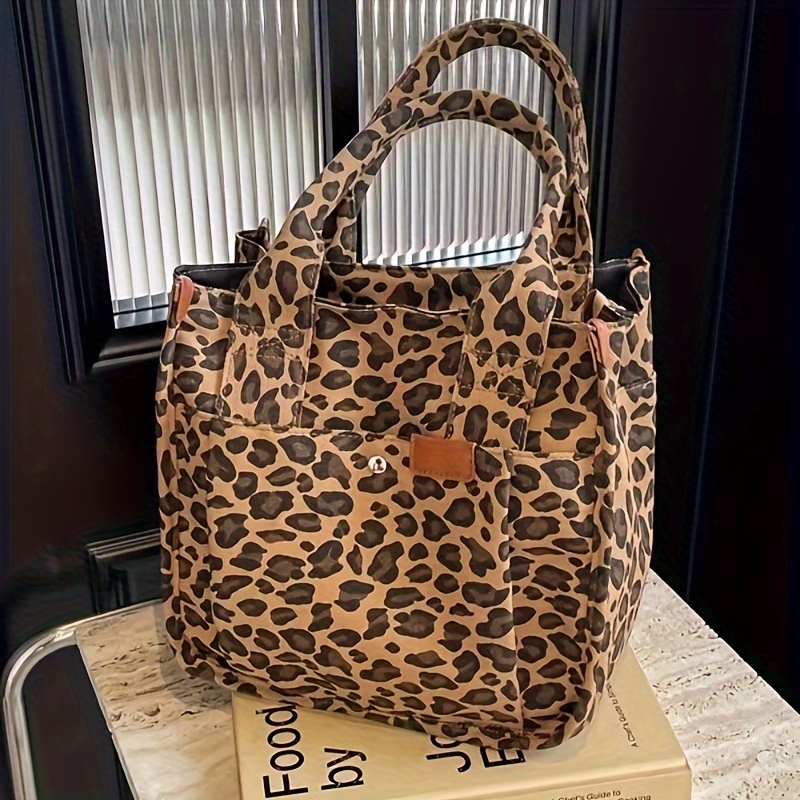 

A Leopard-print Canvas Bag With A Large Capacity And Multiple Pockets, Suitable For Including Daily And Shopping. Its Fashionable And , Meeting The Needs Of Different .