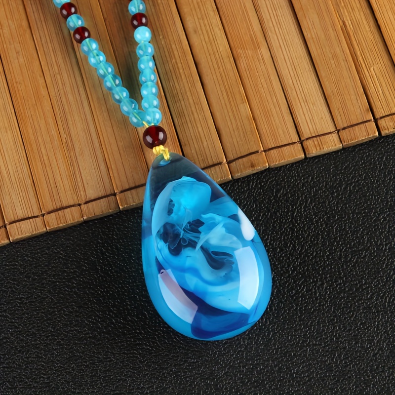 E-shop Vintage Bohemian Style Harz Wasserträne, Blaue Wasserträne Anhänger Durchscheinende Fossil Halskette, Herren- und Damenmode Temperament