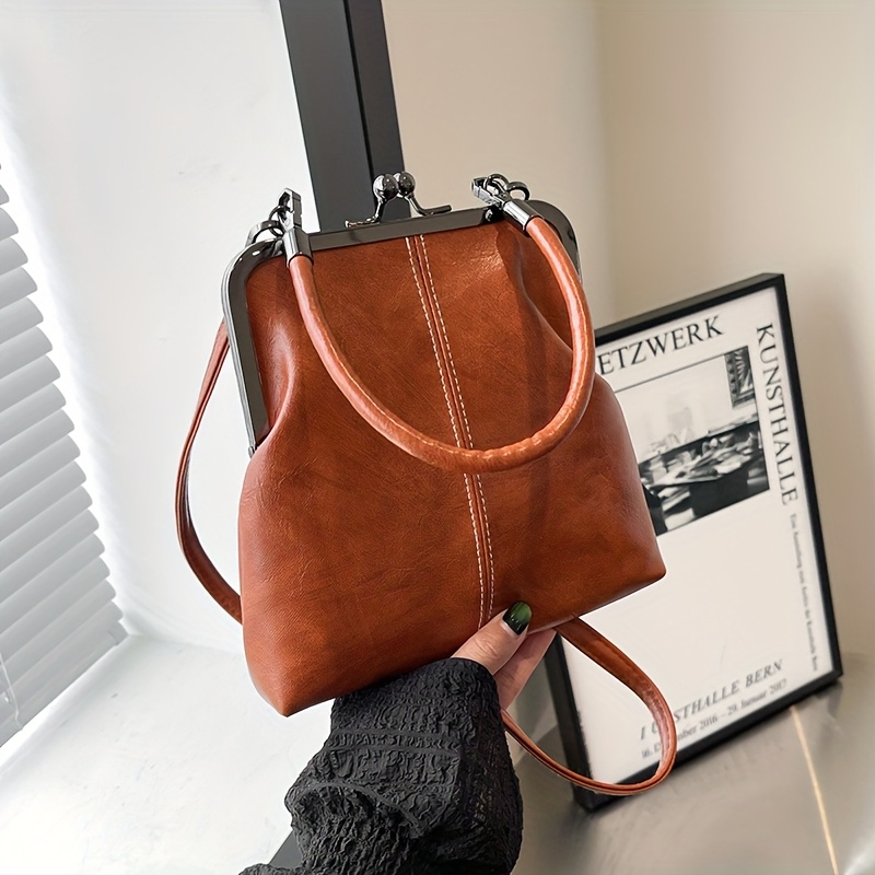 Image of A Stylish Vintage Mini Crossbody Bag Lock, Featuring A Detachable Top Handle, Designed For Women, In Shape Lock Closure