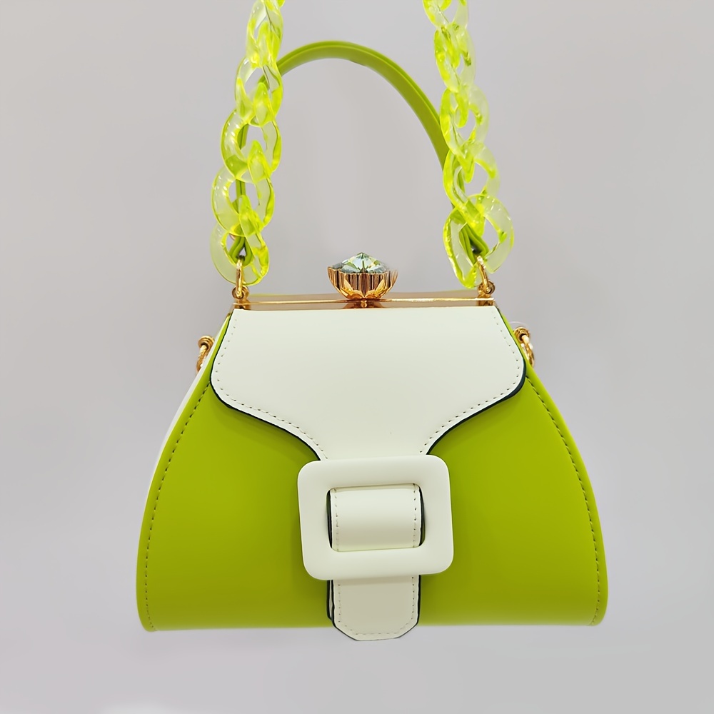 Stylish Two-Tone Round Handbag Made of Durable, Featuring a Detachable Acrylic Chain And Snap Closure. This Versatile Handbag Is Perfect for Both Parties And Everyday Use.