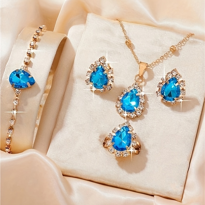 

Elegant Women's Jewelry Set, Luxurious Style, Water Drop Shaped Blue Rhinestone, Includes Necklace, Bracelet, Ring, Earrings Set For Evening & Special Occasions