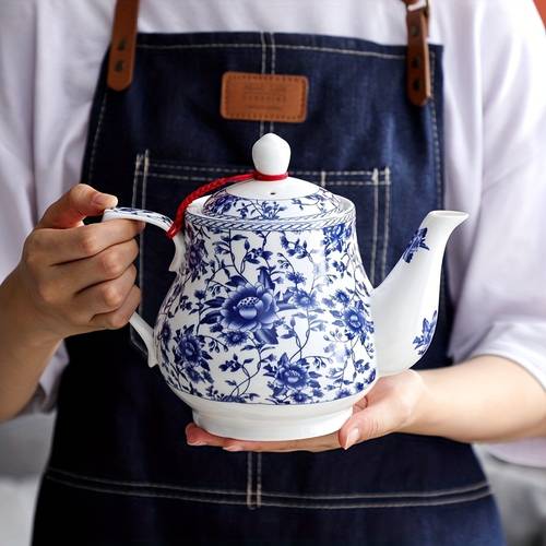 a large blue and white ceramic teapot with a capacity of 33 82 ounces about 1000 milliliters suitable for home and office use featuring a