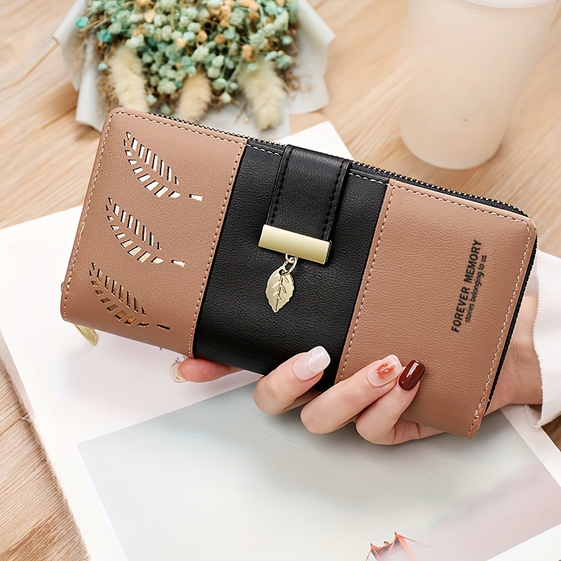 A New Long Wallet For Women Featuring A Spliced With Hollow Leaf Patterns, Suitable For Use As A Handbag Phone Pouch