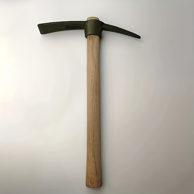 

A Small With A Wooden Handle, Used For Digging, Weeding, And Vegetable In Gardening