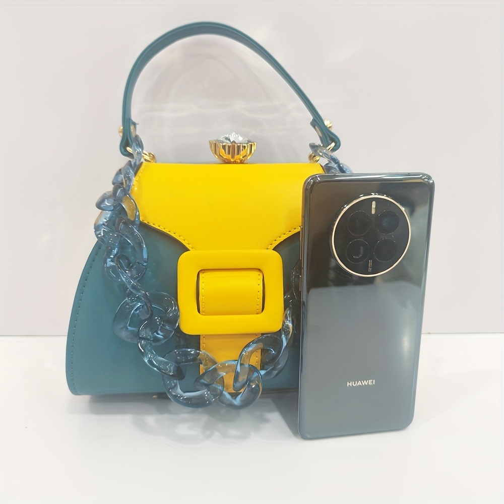 Stylish Two-Tone Round Handbag Made of Durable, Featuring a Detachable Acrylic Chain And Snap Closure. This Versatile Handbag Is Perfect for Both Parties And Everyday Use.