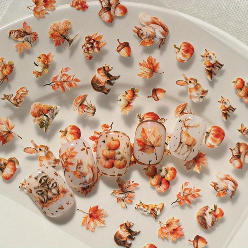 Image of A Golden Autumn-themed Nail Sticker Featuring Embossed Laser Technology, With Hand-painted Cartoon Patterns Including , Elk, Squirrels, Foxes, And More. Suitable For Personal Diy And Nail Salon Use.