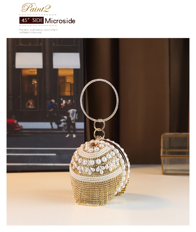 Clutch held by hand showing size