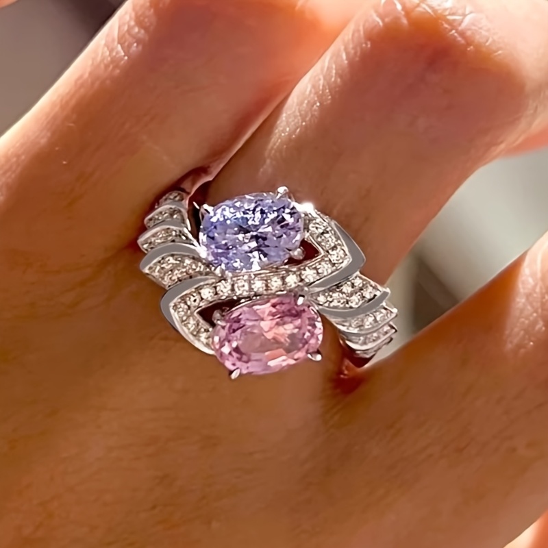 E-shop CUY Damen Luxus Ring in Rosa & Lila mit synthetischem Zirkonia – Vierfach gefasster ovaler rosa synthetischer Zirkonia in der Mitte & umgebender