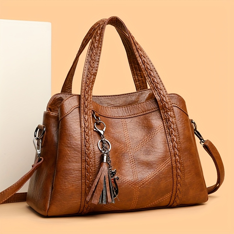 Image of Elegant Vintage-style Women's Handbag, Featuring A Woven Handle And Delicate Cat Tassel Charm, A Versatile And Fashionable Crossbody Bag
