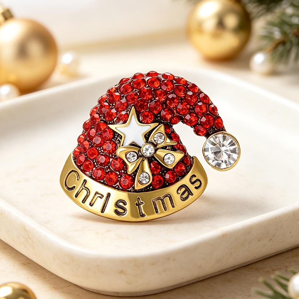 TEMU 1pc Broche de chapeau de Noël tendance, épingle en métal avec chapeau de Père Noël de zircons, avec nœud étoile et badge décoratif de lettres de