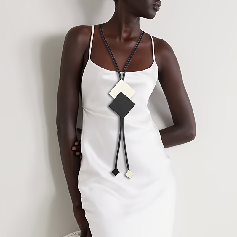 A Vintage Black And White Geometric Accessory Featuring A Pattern, Handcrafted Y-shaped Jewelry, Stylish Necklace