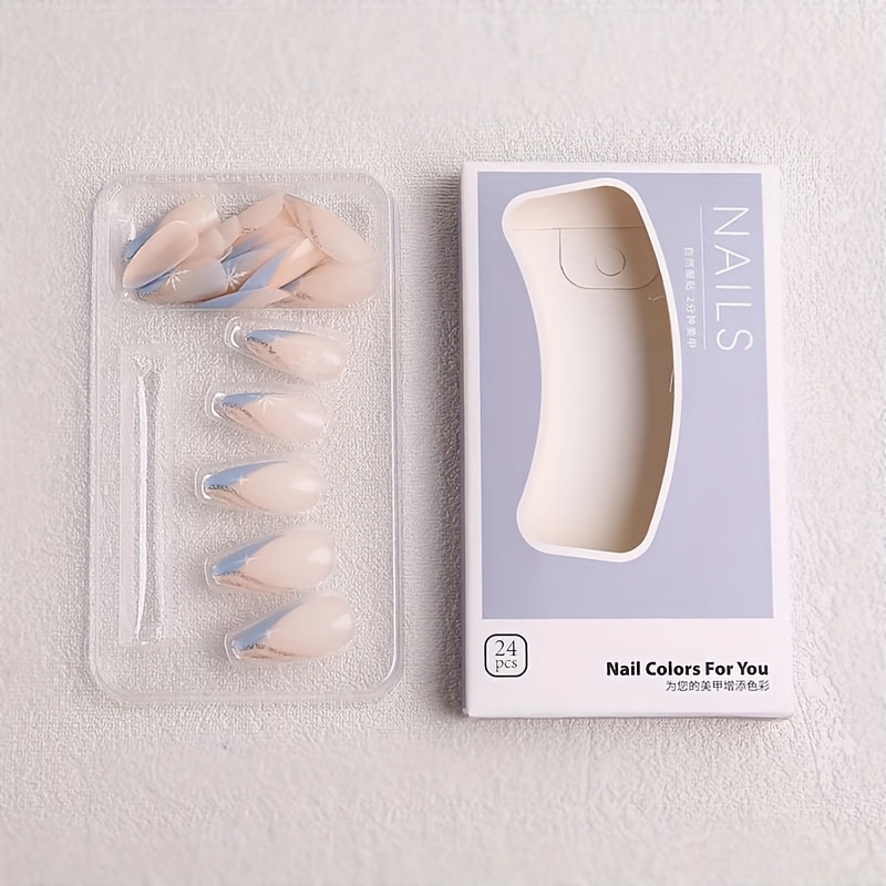 Image of Set Of 24 Winter-themed Press-on Nails Featuring Blue And Nude Glitter Design. Almond-shaped Nails Are With Silvery Snowflake Accents
