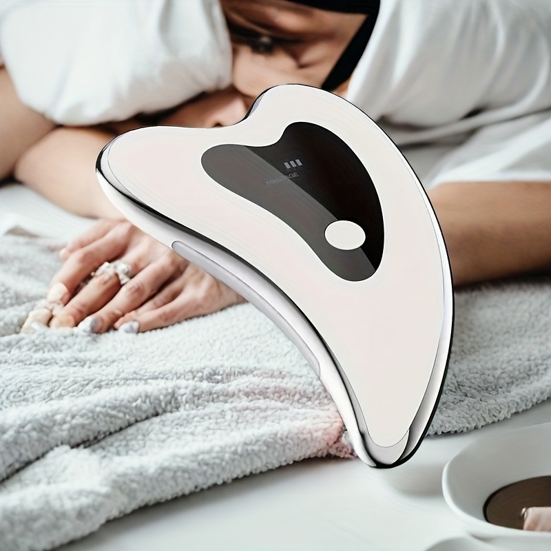 

Masseur Facial Gua Sha Électrique Rechargeable avec Chaleur & Vibration - Chargement USB, Batterie Lithium Polymère 650mAh, Design Ergonomique pour la Relaxation du Visage, du Cou et des Yeux