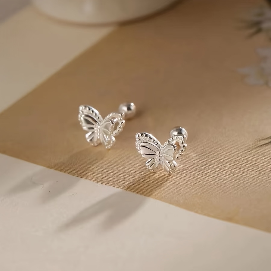 a pair of ladies fashionable hollow   stud earrings with 925 spiral silvery   featuring a silvery plating for a minimalistic light luxury look suitable for daily wear parties vacations and making great gifts Product details 6