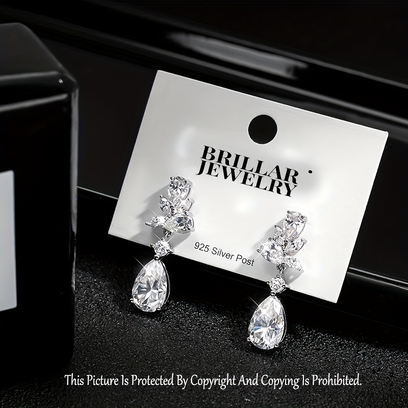 

Super Luxurious 8.8cttw Earring, 7*11mm, Main Stone Is 3ct Teardrop-shaped Full Moissanite-embedded Marquise Stud.