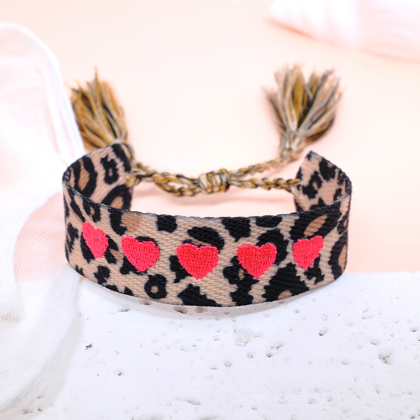 A Stylish Vintage Handmade Bracelet Featuring A Pink Heart And Leopard Print Design