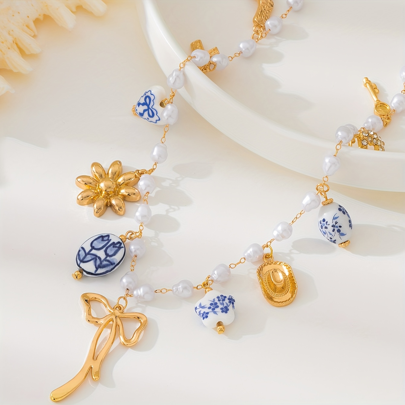 Image of A Stylish And Elegant Metal Bow Necklace With Pearl And Ceramic Heart, Perfect For Women To Wear On Daily Occasions, Parties, Or Vacations (each Tulip Hand-painted Design )