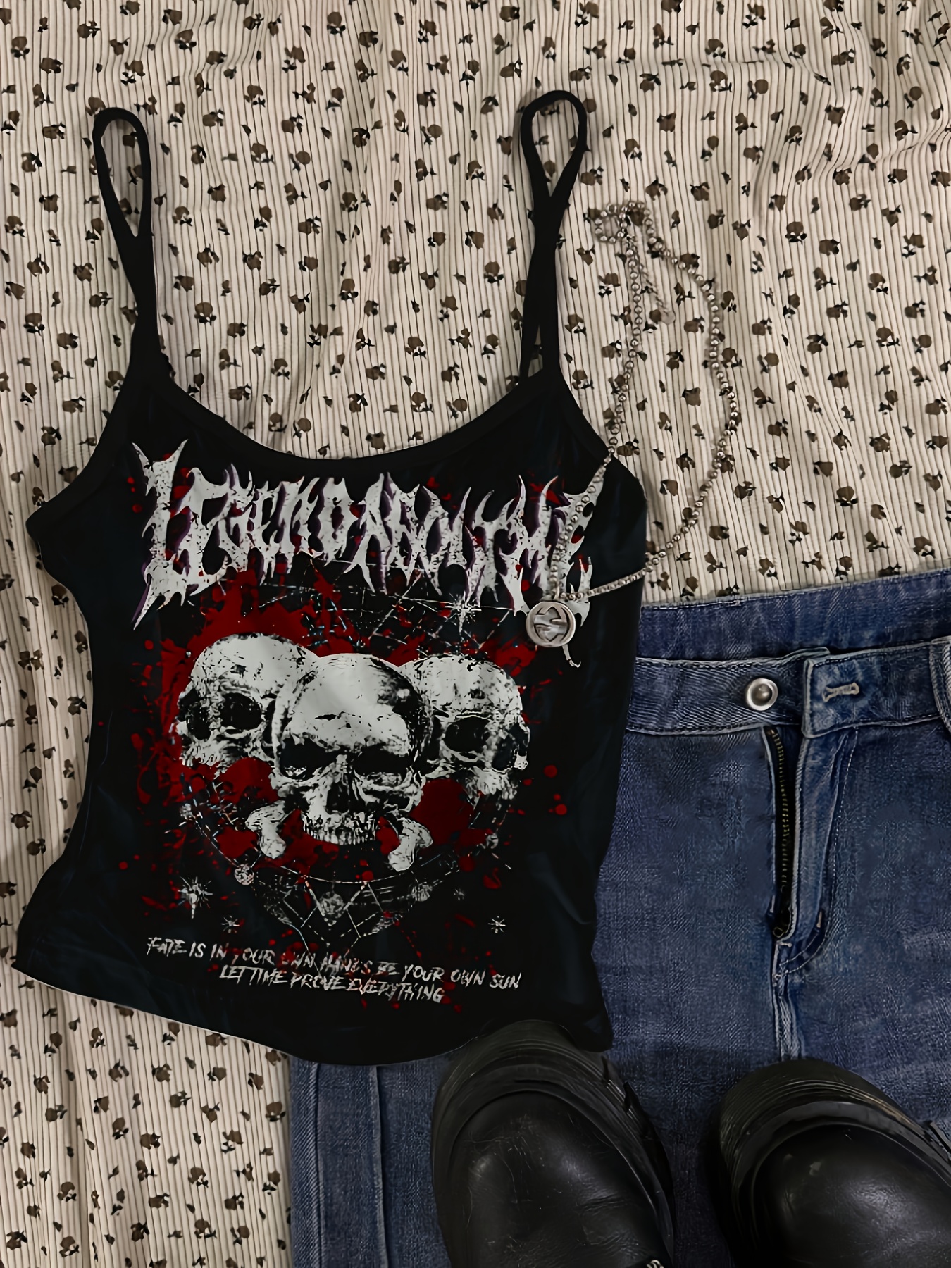 directional dark-themed sleeveless tank top with skull print and