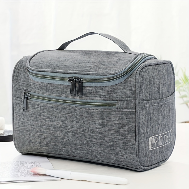TEMU A Composite Wear-resistant Cosmetic And Toiletry Storage Bag With A Large Opening, Top Handle, And Internal Hooks For And Carrying. The Interior