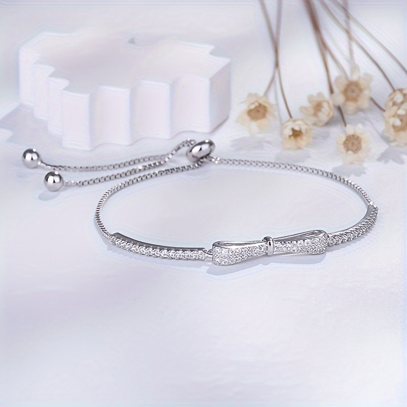 Sterling Silver Bow Bracelet CZ December Birthstone