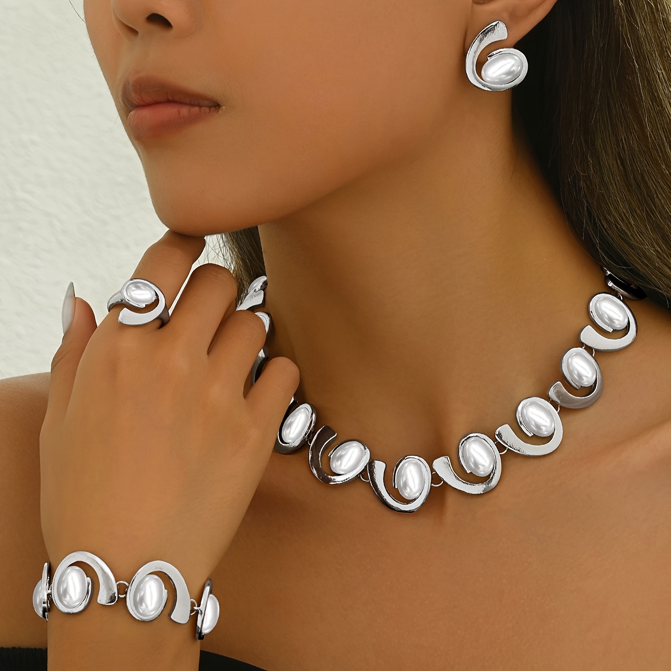 A 4pcs Set For Women Featuring And Stylish Silvery Geometric Hollow Spiral Oval Design, Including A Necklace, Bracelet, Earrings, And Ring White Acrylic Oval Pearl Shapes. A Party Jewelry Set