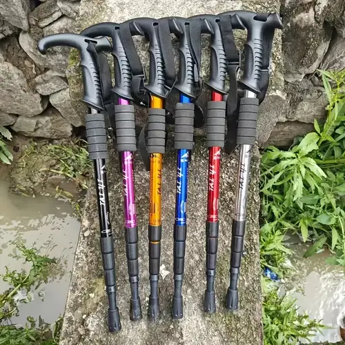 ultra lightweight adjustable hiking cane with ergonomic t shaped handle and shock absorbing system durable aluminum alloy comfortable grip suitable for hiking exploration