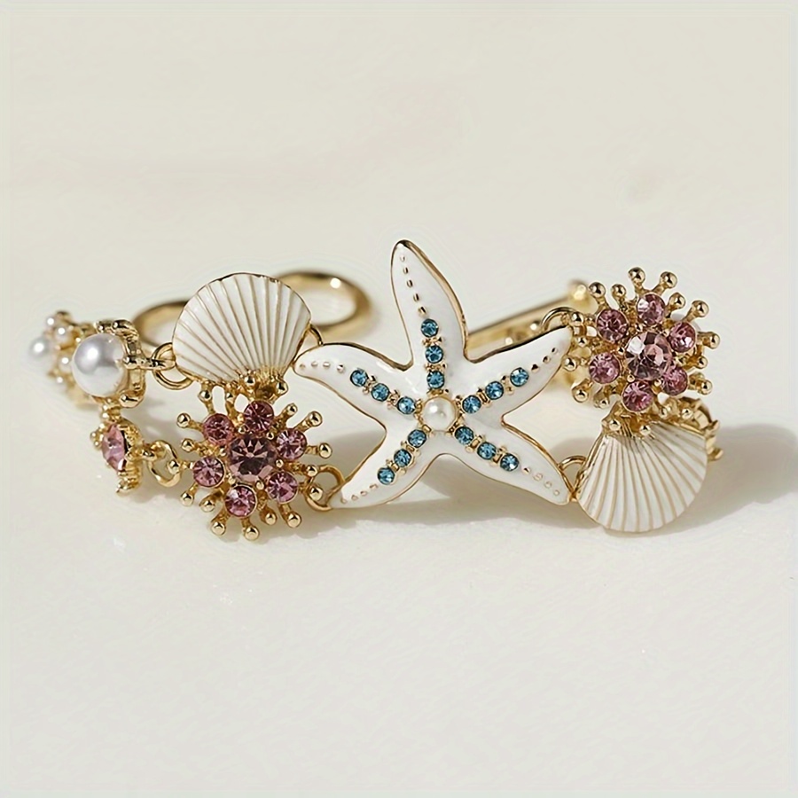 One gorgeous starfish pendant bracelet with shell details and sea coral beads suitable for beach daily wear and ocean vacation style