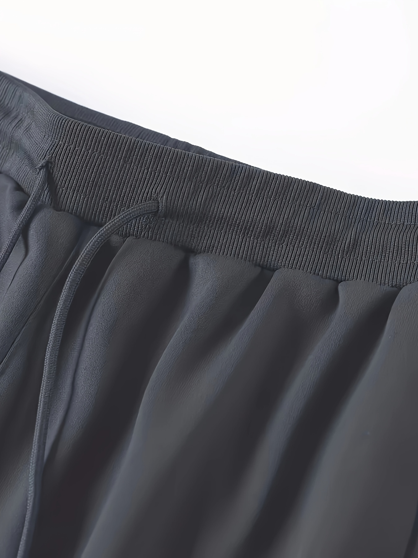 Four-piece set of new Men's casual sports pants, perfect for spring and summer. Made with 100% polyester quick-dry fabric that prevents Light Beige irritation after intense sweating and is durable. Features a slight stretch technology for unrestricted movement during jumping and turning, allowing full freedom in any activity. Ideal for gym workouts, outdoor hiking, daily commuting, rock climbing, city cycling, and fitness training