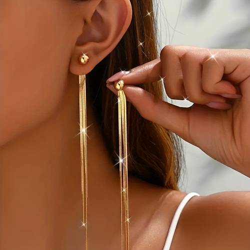 une paire de boucles doreilles à pompon, boucles doreilles longues en métal avec pompon en os de et créatif pour femmes