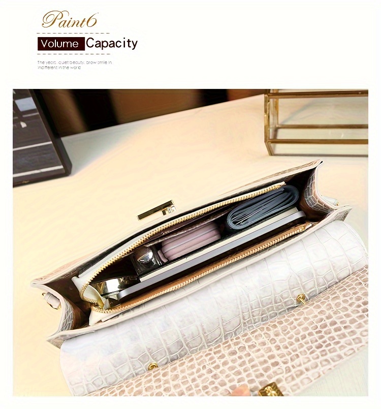 Handbag on model standing in urban setting