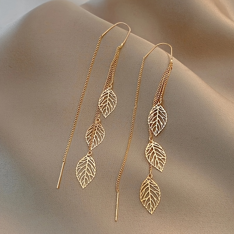 TEMU 1 paire de boucles d'oreilles pendantes à pompons avec feuilles ajourées, style long, polyvalentes, avec crochets d'oreille